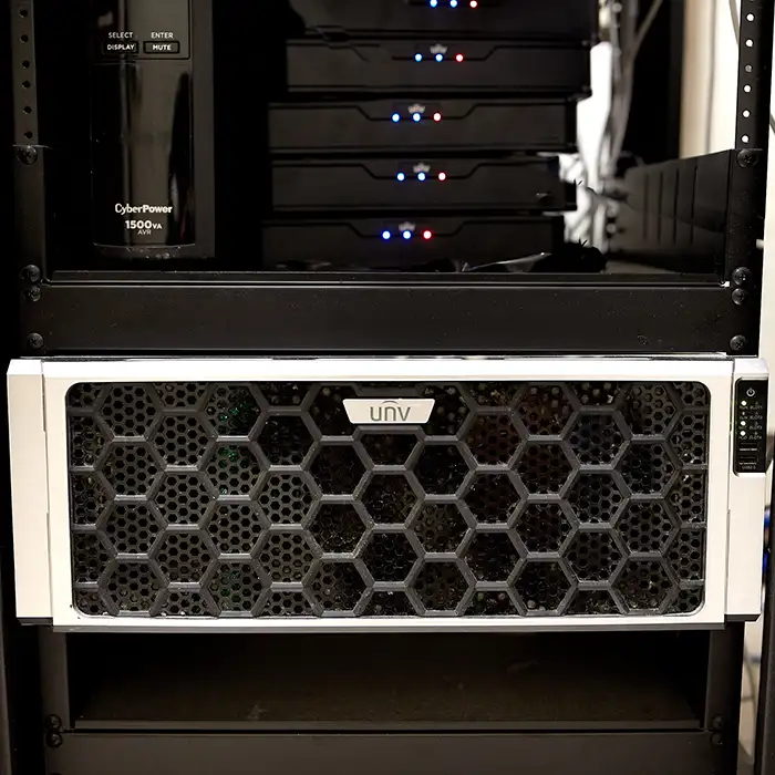 A large video recording server made by Uniview with a black hexagon pattern on the front