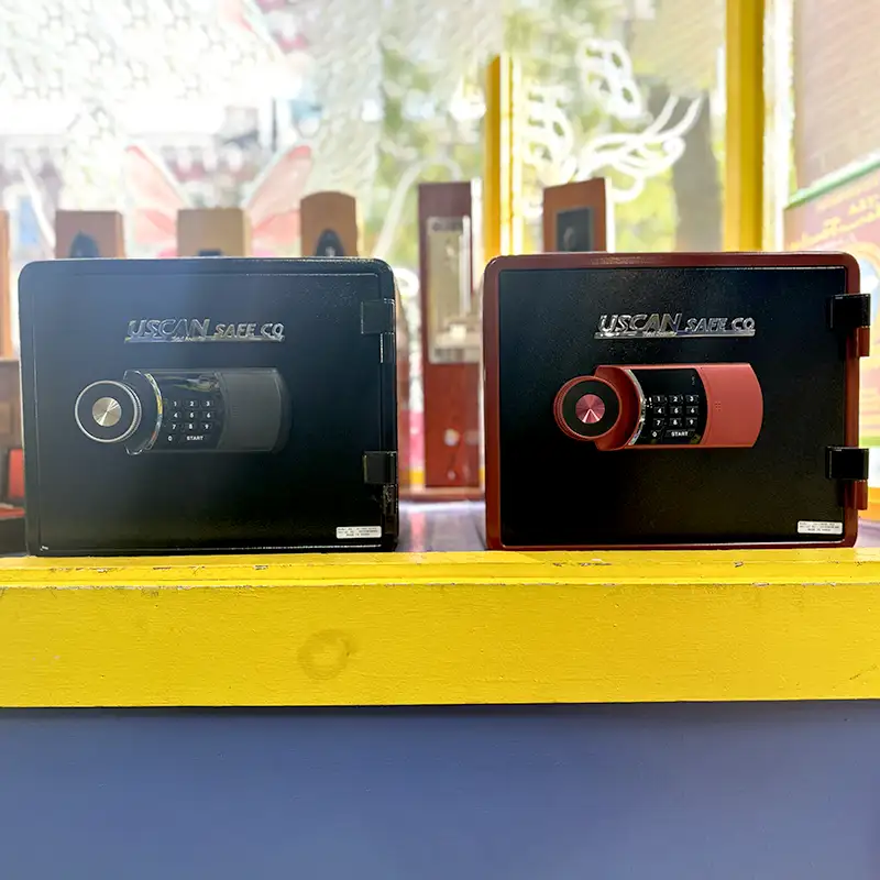 Two uscan safes display on a yellow and blue shelf